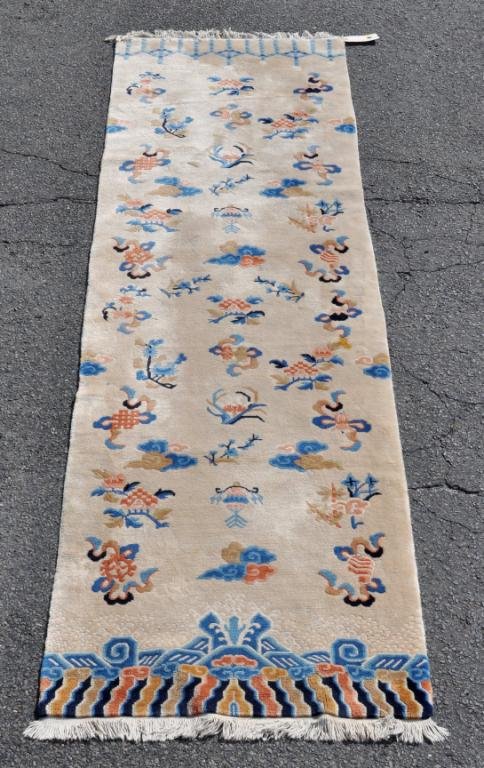 Chinese Runner: Chinese runner having various symbols on a cream ground. 9' 6" long, 2' 6 1/2" wide. Condition: a couple low spots. All rugs sold "as is".