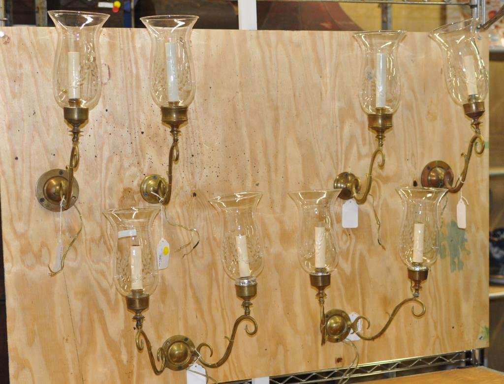 Pair Brass Two Arm, Four Single Arm Wall Sconces: A pair of brass two arm sconces and two pair brass single arm sconces, all with etched glass shades and wood back plates. 15" high, 8" wide to 15" high, 14" wide. Condition: repairs, one loose candle