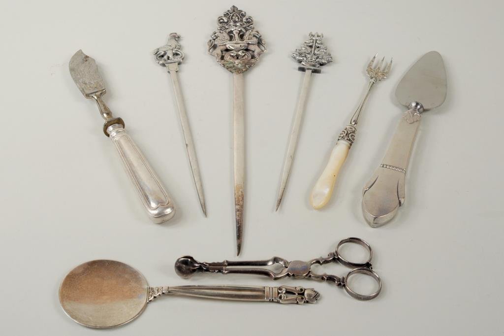 Group Silver Utensils: Group of silver utensils, 19th/20th century, including a George Jensen server, sugar tongs and three skewers. 4 1/2" long, 2" wide to 10" long, 1 3/4" wide. Weighable silver: 6.075 OZT.
