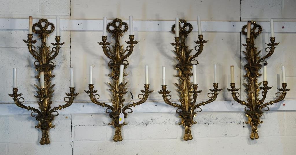 Four French Style Brass Five Light Wall Sconces: Four French style brass five light wall sconces with cast wheat, ribbon and tassel decoration, 20th century. 33" high, 16 1/2" wide.
