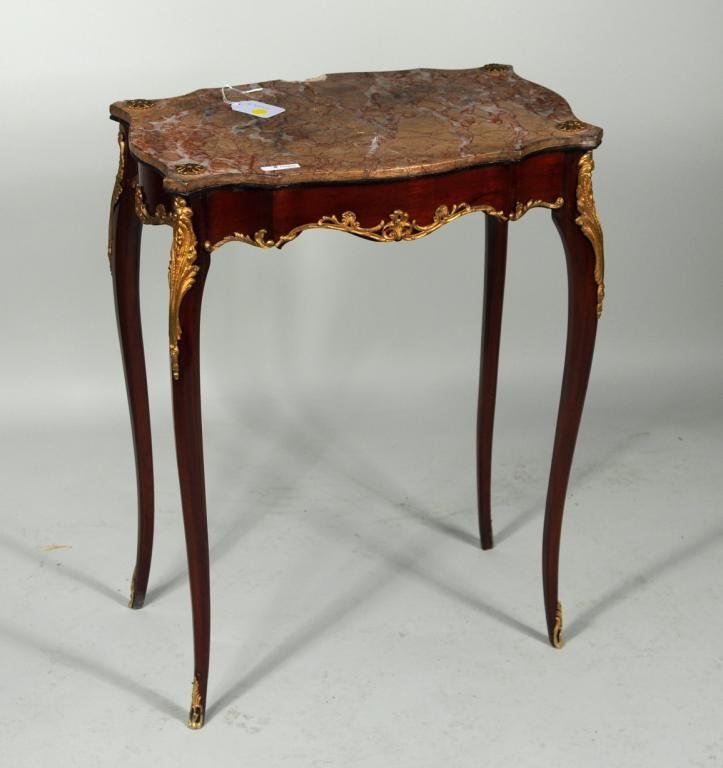 Louis XV Style Gilt Bronze Fruitwood Table: Louis XV style gilt bronze fruitwood table de salon with pink marble top, circa 1900. 29 1/4" high, 22" wide, 15" deep. Condition: breaks, losses to marble top.
