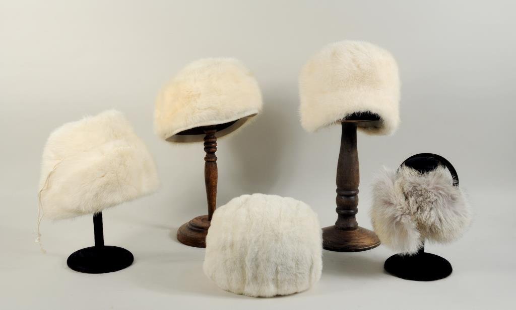 Five White Mink Items: Three white mink hats, a muff and a pair of earmuffs.
