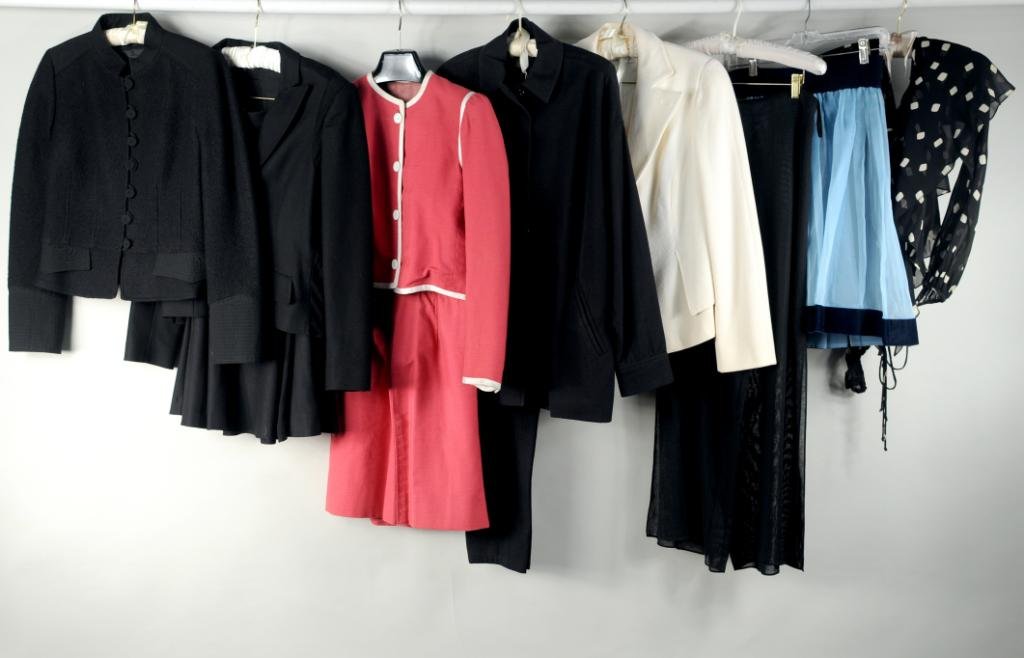 Eleven Designer Clothing Articles: Eleven designer clothing articles including a black wool skirt suit by Alexander McQueen size 42, black pant suit by Donna Karan size 2, black boiled wool jacket, blue chiffon skirt by Zang Toi, pink