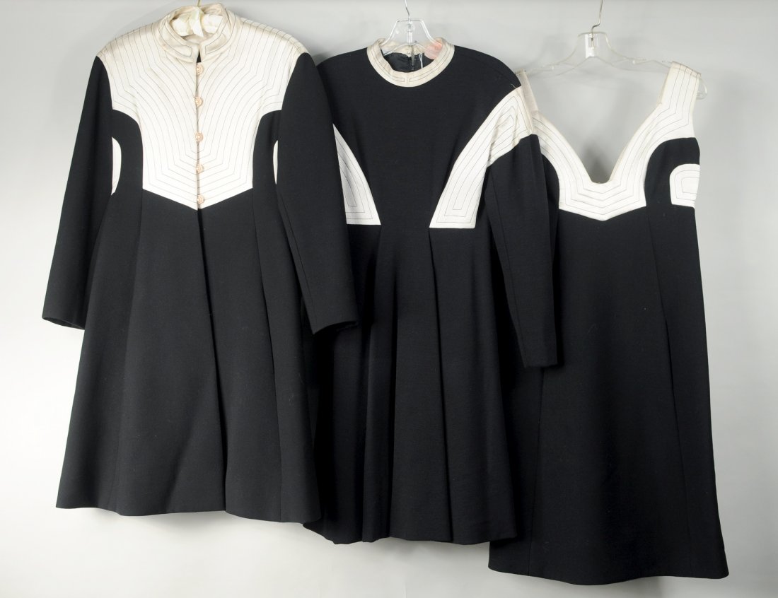 Three Ronald Amey Clothing Items: Three Ronald Amey wool clothing items comprising two black and white wool dresses, one with long sleeves and one sleeveless, together with a matching black and white wool coat.