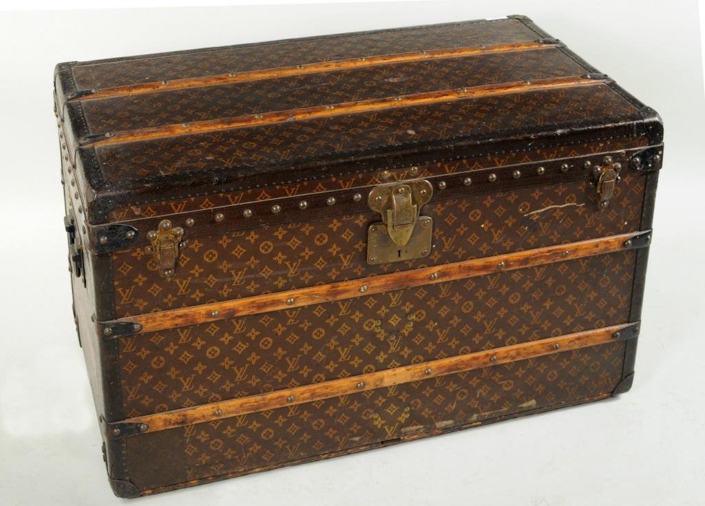 Vintage Louis Vuitton Steamer Trunk: Vintage Louis Vuitton steamer trunk with original label in interior, stamped 746363 with key but lacking tray. 21 1/4" high, 35 3/4" wide, 20" deep.