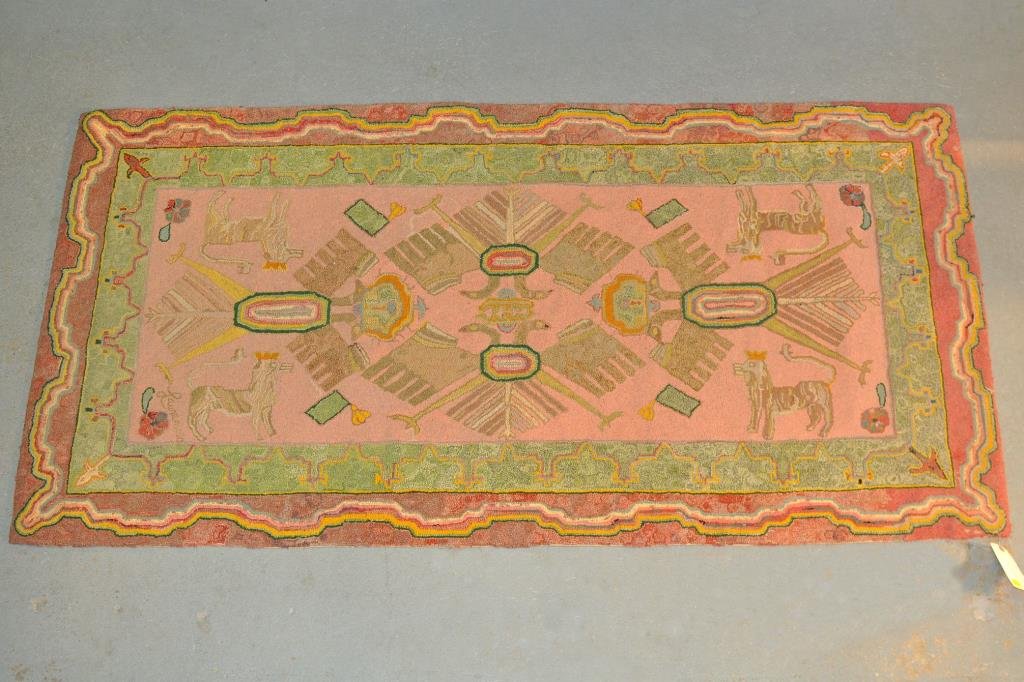 Folk Art Hooked Rug: Unusual folk art hooked rug, depicting crowned two-headed eagles and lions in shades of taupe, rose and green, first half of 20th century, signed "Laurencio". 37 1/2" wide, 71 1/2" long.