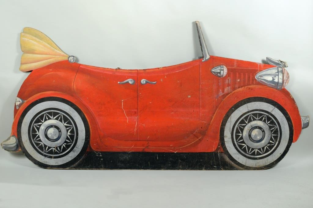 CA Painted Automobile Trade Sign, Canvas on Board: California painted canvas on board, automobile trade sign or movie prop depicting an early convertible by Scenic Artists, Los Angeles, California logo, stenciled on verso. 48 1/2" high, 8' 6" long.