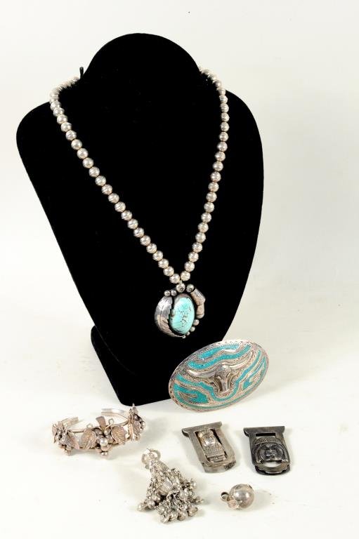 Native American, Mexican & Other Silver Jewelry: Native American, Mexican and other silver jewelry items, 20th century, including a Navajo turquoise necklace, a Mexican buckle and other items. 1" wide, 1" high to 1 3/4" wide, 11 1/2" long. Gross Wei