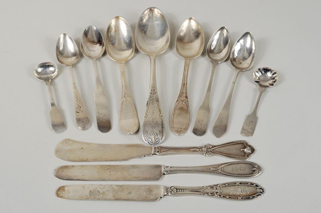 Group Nine Coin & Sterling Silver Utensils: Nine coin and sterling silver utensils by various makers including Badger & Dillon, Wm. Wise, J.F. Jones and others together with three silver plate utensils. 3 1/2" long, 1" wide to 6 3/4" long, 1 1/