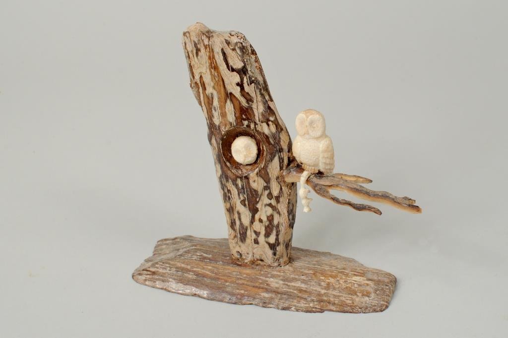 Inuit Carved Walrus and Fossil Ivory Sculpture: Inuit carved walrus and fossil ivory sculpture depicting an owl's nest initialed verso "JSA", signed on base "JSA Anabie?". 5" high, 4 3/4" long.