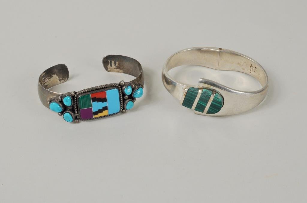Two Sterling & Stone Bracelets: Two sterling and stone bracelets comprising a Mexican malachite bracelet stamped "GMS? 925 Mexico" and a Native American bracelet stamped "IRV Sterling". 1" high, 2 5/8" wide. Gross weight: 3.455 OZT.