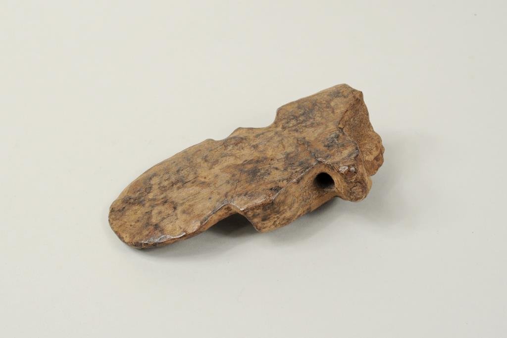 Inuit Fossilized Warriors' Spear Emblem: Inuit fossilized warriors' spear emblem. This butterfly emblem is a symbol of leadership and indicates it belonged to a clan leader. 4 1/2" high, 2 1/2" wide.