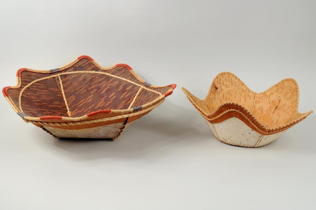 Inuit Birchbark & Grass Baskets, Signed: Two Inuit birchbark and grass baskets, both signed on base, one signed "Hazel E. Menke", one signed "Belle Deson". 5" high, 9 1/2" diameter to 5" high, 14" diameter.