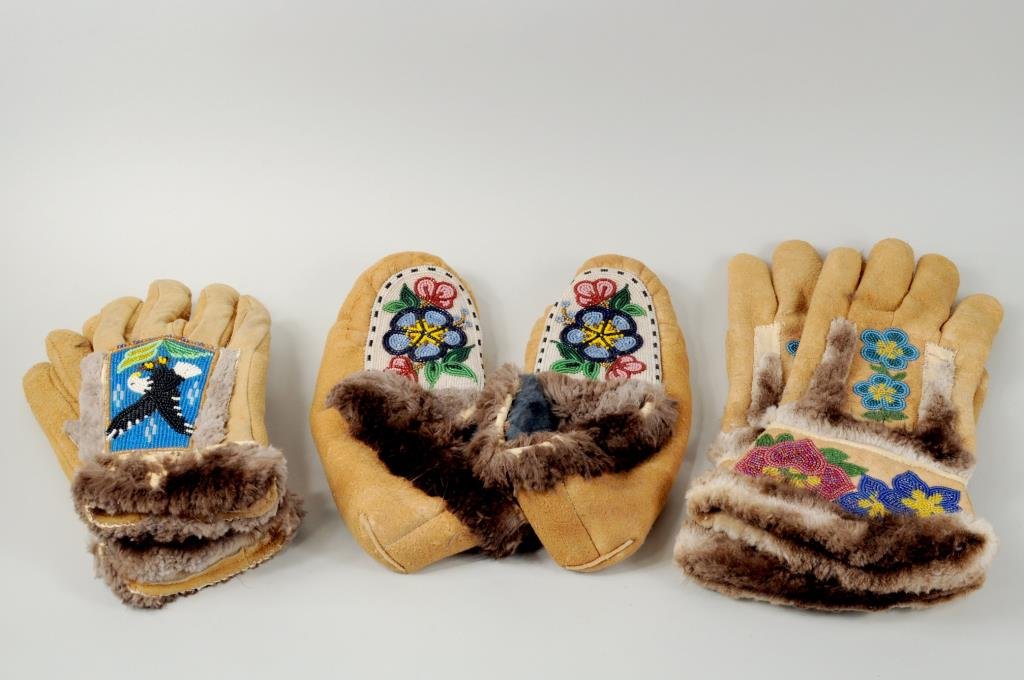 Inuit Moose Hide Beaded Gloves & Slippers: One pair Inuit moose hide beaded gloves and pair of slippers, together with a pair of commercial beaded gloves. 10" high, 4 1/2" wide to 13 1/4" high, 7 1/2" wide.