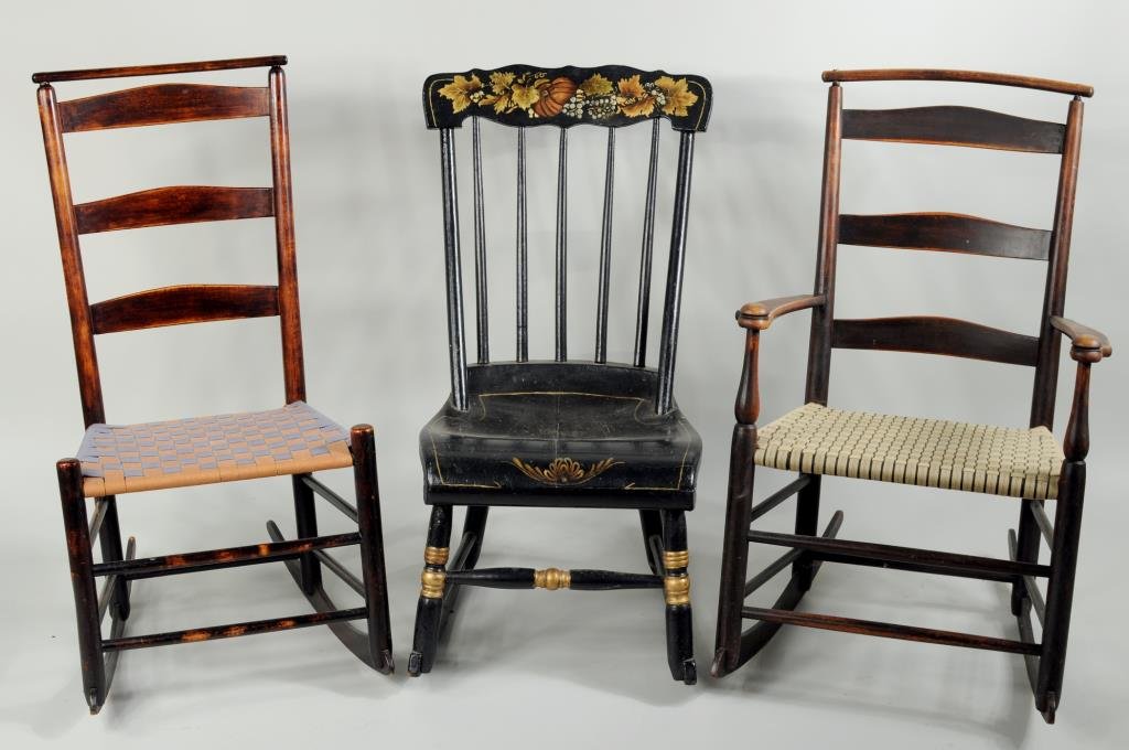 Shaker Style Rocking Chairs & Stenciled Rocker: Three rocking chairs comprising two Shaker or Shaker style and a stenciled rocker. 32" high, 18 1/4" wide, 16 1/4" deep to 33 1/2" high, 20 3/4" wide, 15" deep.