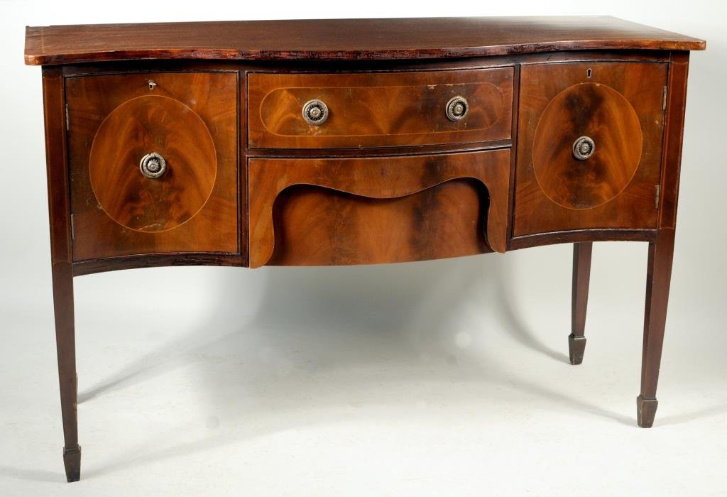 Hepplewhite Style Mahogany Serpentine Server: Hepplewhite style inlaid mahogany serpentine server, line inlaid top with serpentine front over a conforming base with a pair of cabinet doors flanking two long drawers, raised on line inlaid tapering