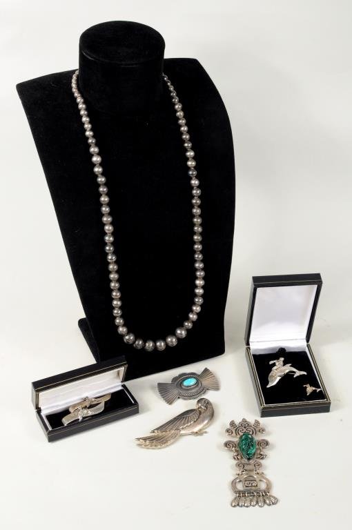 Group Silver Jewelry Items: Group of silver jewelry items, comprising a "Genuine Norseland" sterling dove pin, a Mexican malachite sterling pin/pendant, a Lunt sterling pin, tie tac and two tie clips, a Navajo pin, silver beads,