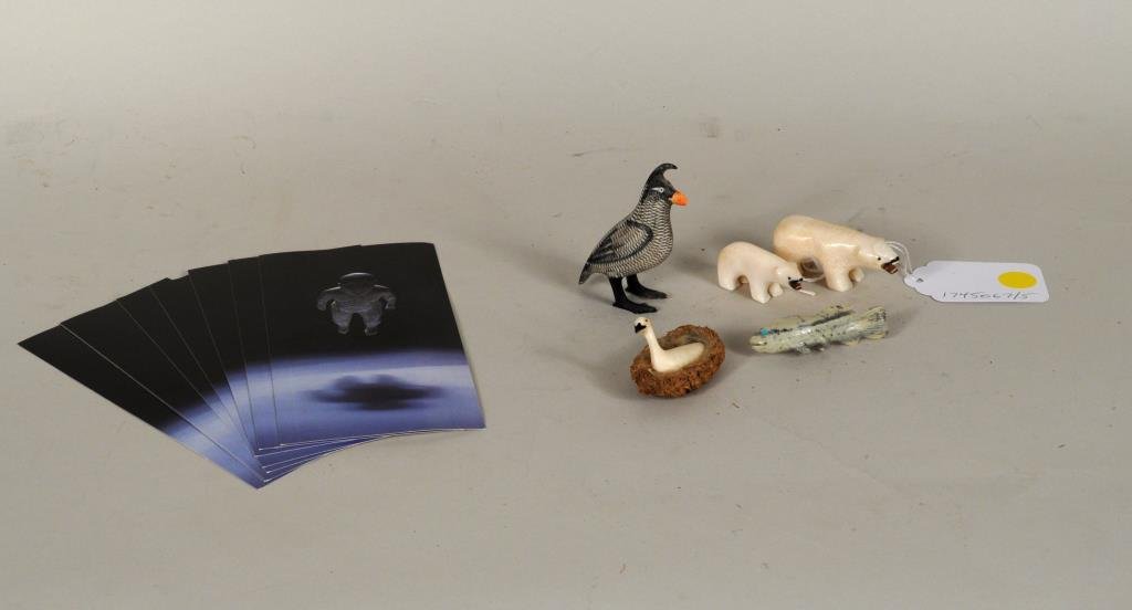 Four Inuit Carved Walrus Ivory Animals: Four Inuit carved walrus ivory animals, comprising a scrimshaw bird, two polar bears and swan together with a hardstone salmon tie tac. 1 1/2" high, 2 1/4" long to 3" high, 2" wide. International clie