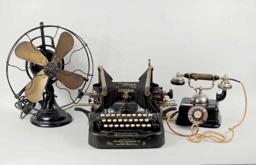 Vintage Oliver Typewriter, Phone & GE Fan: A vintage "Oliver No. 9 Standard Visible Writer", patent date 1917, a vintage Scandinavian phone and a GE oscillating fan. 8 1/2" high, 10" wide to 16" high, 13" wide. Condition: use wear, soiling, ru