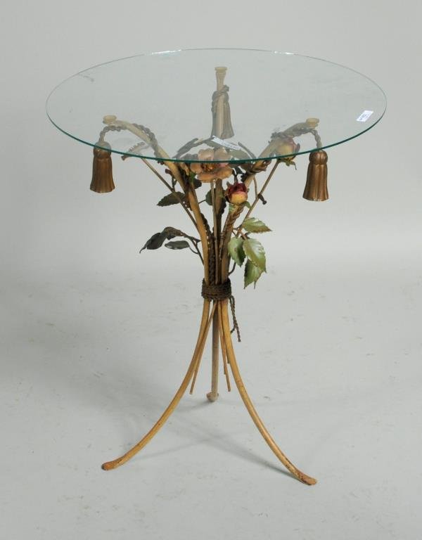 Small Tole Painted Floral & Tassel Table: Small tole painted floral and tassel table with glass top. 22 1/4" high, 19 1/4" wide. Condition: rust, paint wear, loss.