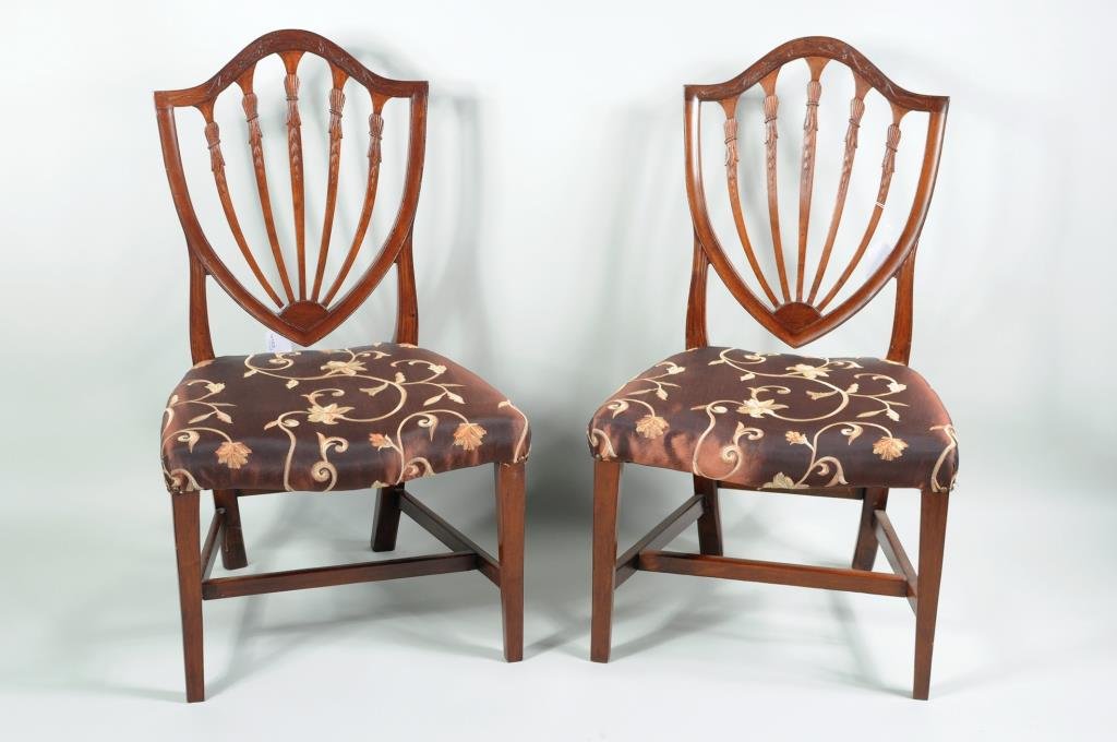 Pair Salem Hepplewhite Carved Mahogany Side Chairs: Pair of Salem Hepplewhite carved mahogany side chairs, with carved arched crests, shield backs with five carved slats, on square tapering legs. 39" high, 21.5" wide, 18" deep. Condition: repairs to le