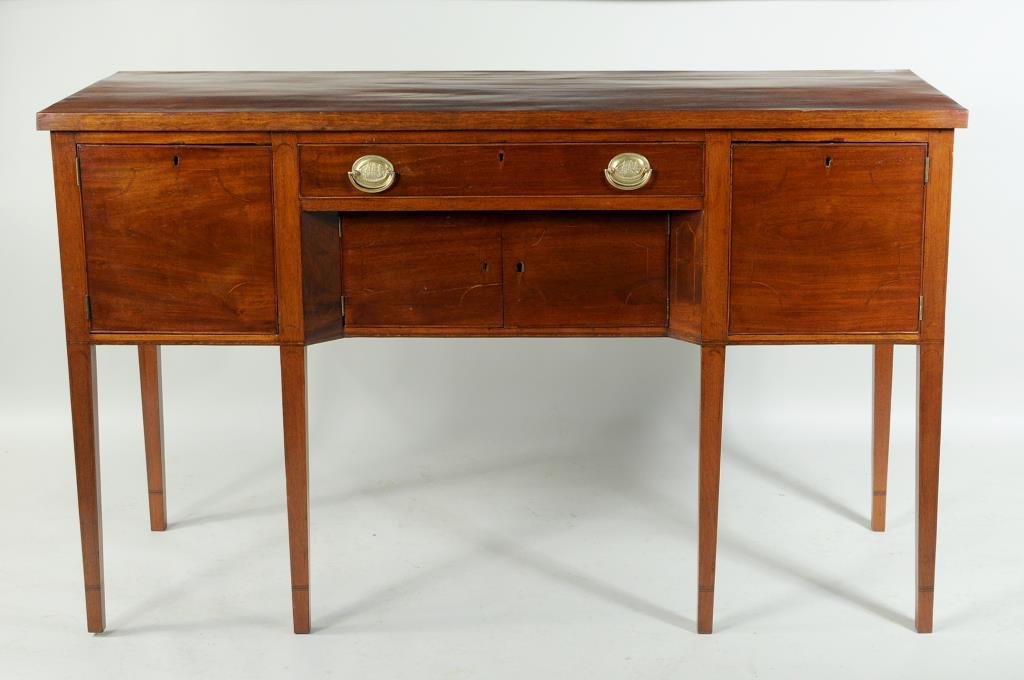 Bench Made Hepplewhite Style Sideboard: Bench made inlaid mahogany Hepplewhite style sideboard, having long drawer over recessed doors flanked by cabinet doors, all string inlaid,late 19th/early 20th century. 40" high, 66" wide, 24" deep. C