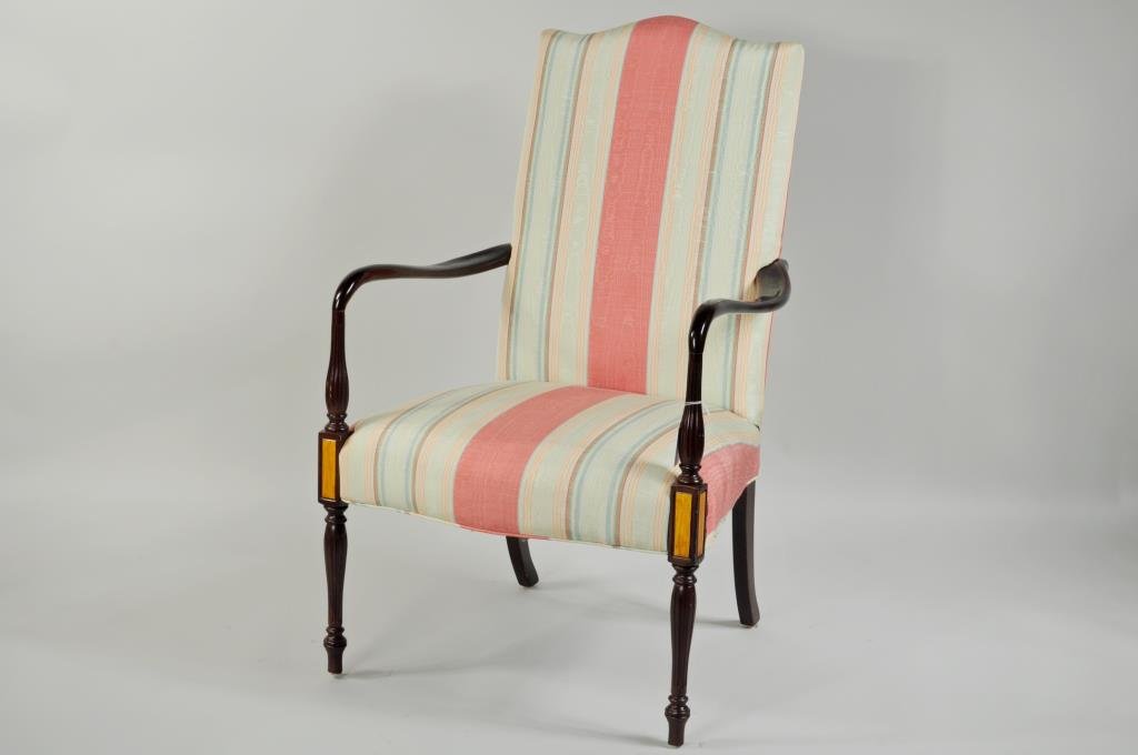 Sheraton Style Portsmouth Lolling Chair: Sheraton style Portsmouth lolling chair, replica Federal chair with fluted legs and arm supports, and having satin birch panels. 43 1/2" high, 27" wide, 25" deep.