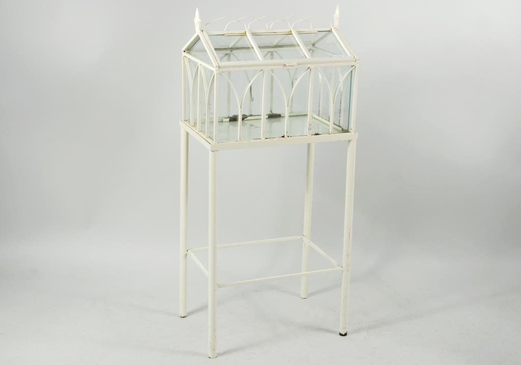 Iron & Glass Terrarium On Stand: Iron and glass terrarium on stand. 42 1/4" high, 18" wide, 12 1/2" deep. Condition: paint wear, loss, rust.