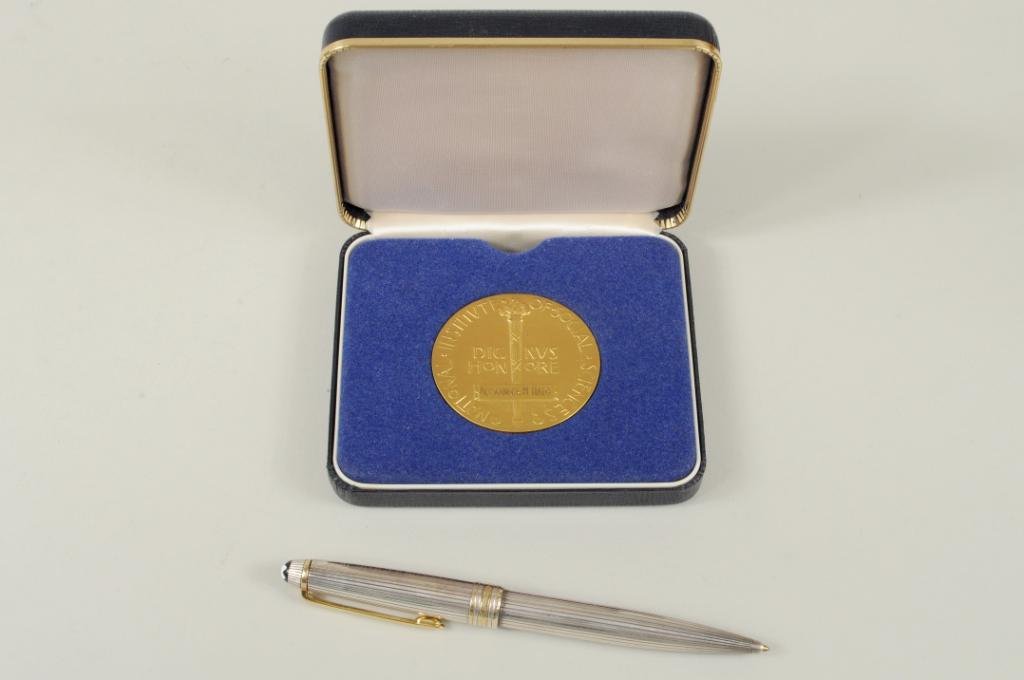 Two Alexander Haig Personal Effects Items: Two Alexander Haig memorabilia items comprising a gilt bronze medal from The National Institute of Social Sciences and a Montblanc Meisterstuck sterling silver ballpoint pen, the medal engraved "Alexa