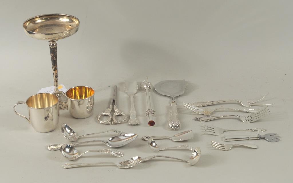 Group Small Sterling Silver Items: Group of small sterling silver items, including a Georg Jensen scoop, an S. Kirk & Son child's fork, a weighted tazza and ten other sterling items together with seven silver plate items. 3 3/4" long, 