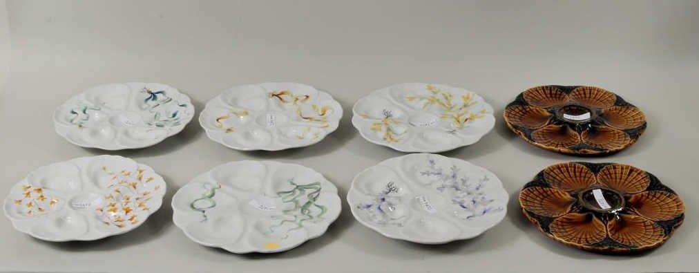 Six French "Le Chambrelain" Oyster Plates: Six French "Le Chambrelain" hand decorated oyster plates together with two Sarreguemines plates. Approximately 9 3/4" diameter. Condition: slight enamel wear.