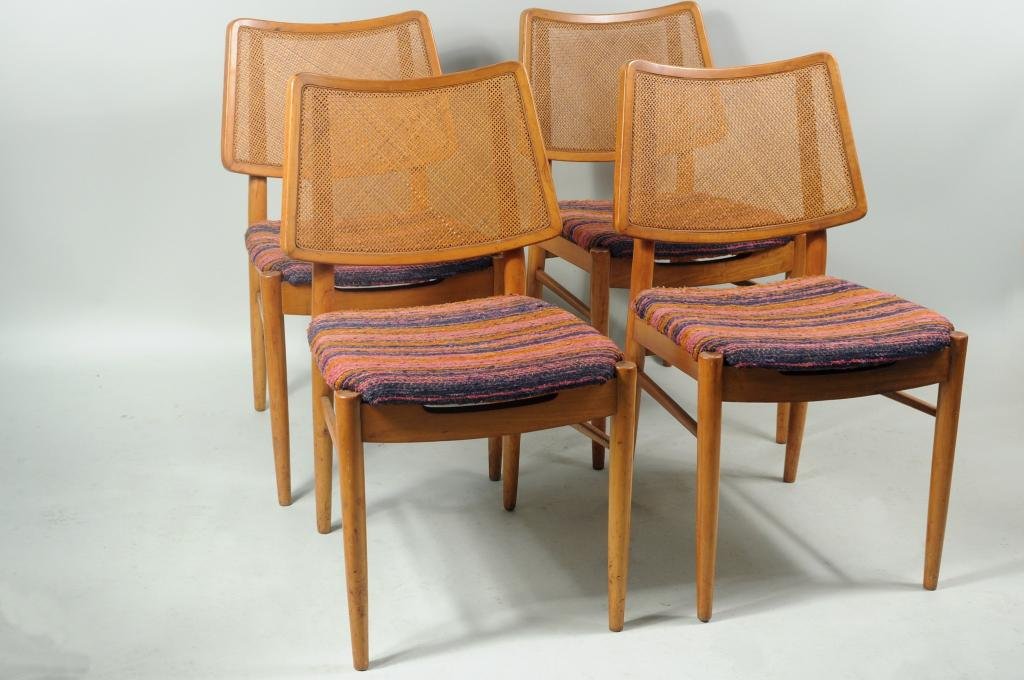 Four Mid Century German Walnut Side Chairs: Four mid century German possibly walnut caned side chairs, with upholstered seats, stamped "Made in Germany" on underside, retailed by Fabry Associates. 32" high, 19" wide, 18" deep. Condition: finish