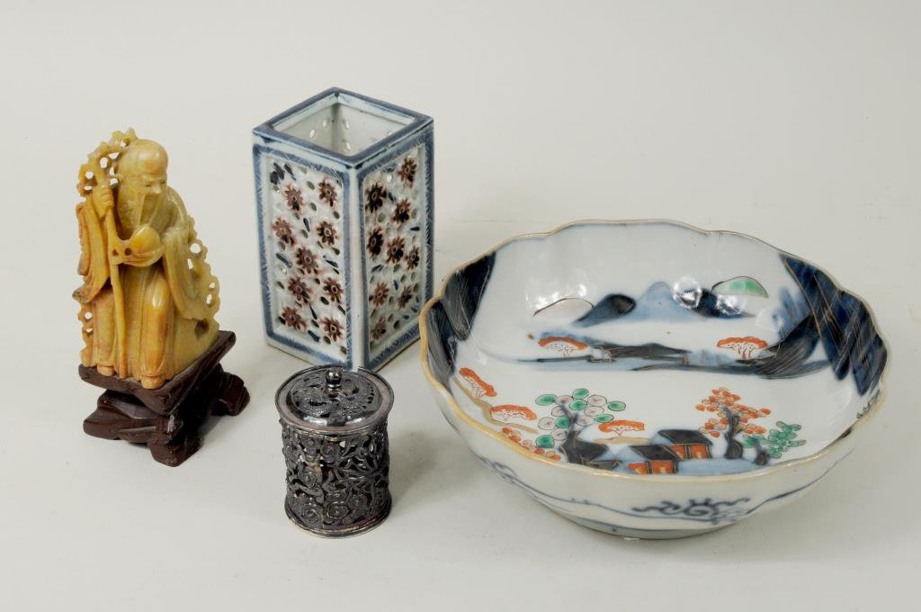 Four Asian Decorative Arts Items: Four Asian items including a Chinese porcelain bird feeder, Tao Kuang Period (1821-1850), a Chinese pierced silver container, hallmarked Wang Hing and other items. 2 1/2" high, 1 3/4" wide to 7" diame