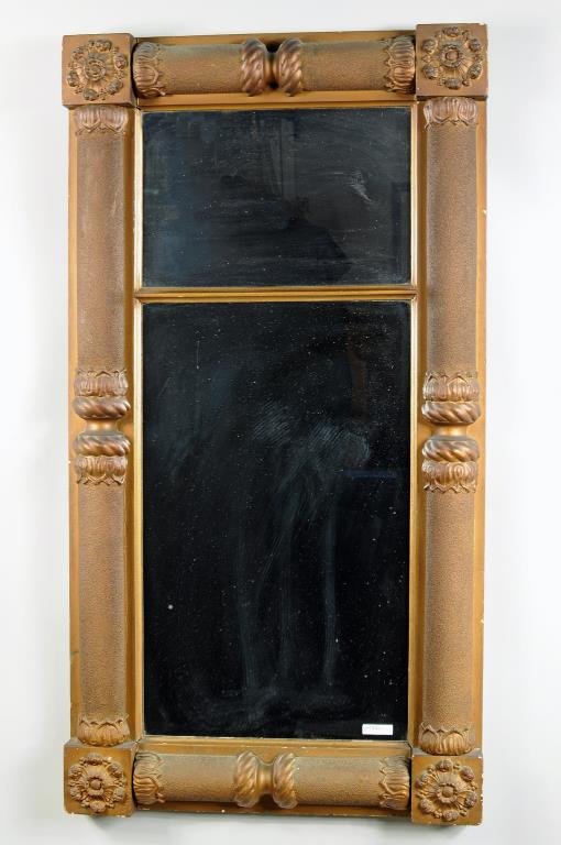 American Classical Giltwood Pier Mirror: American classical giltwood pier mirror, with split pilaster frame and rosette blocked corners. 45" high, 23 1/2" wide. Condition: small losses and chips.