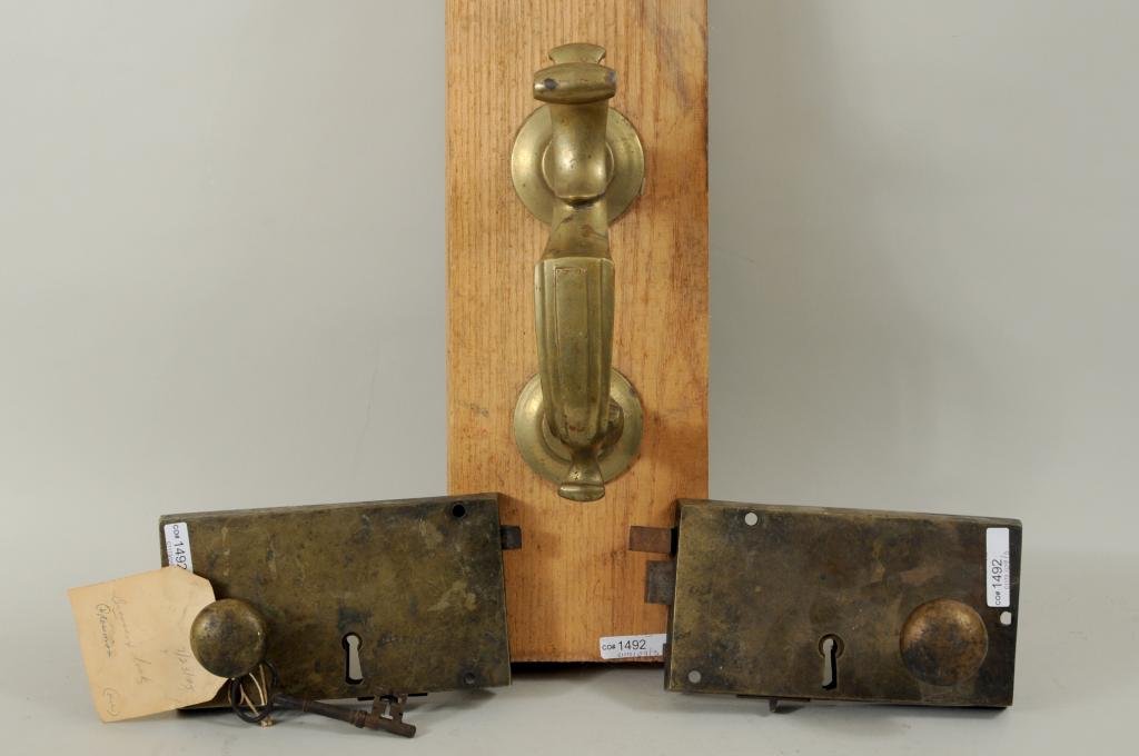 Three Period Brass Hardware Fixtures: Three period brass hardware fixtures, including a vintage brass knocker and two period box door locks, with key. 9 1/2" long, 3" wide to 9" long, 4 1/4" wide. Condition: use wear, scratches, oxidation