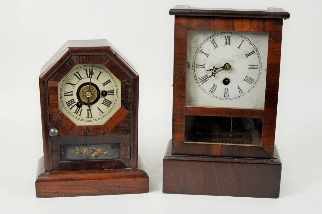 Ogee Shelf Clock & Seth Thomas Cottage Clock: Two mantel clocks comprising a miniature ogee shelf clock by Welch Mfg., Forestville, CT. Circa 1855 with thirty hour movement, spring driven time and strike and alarm, printed paper label, and a Seth