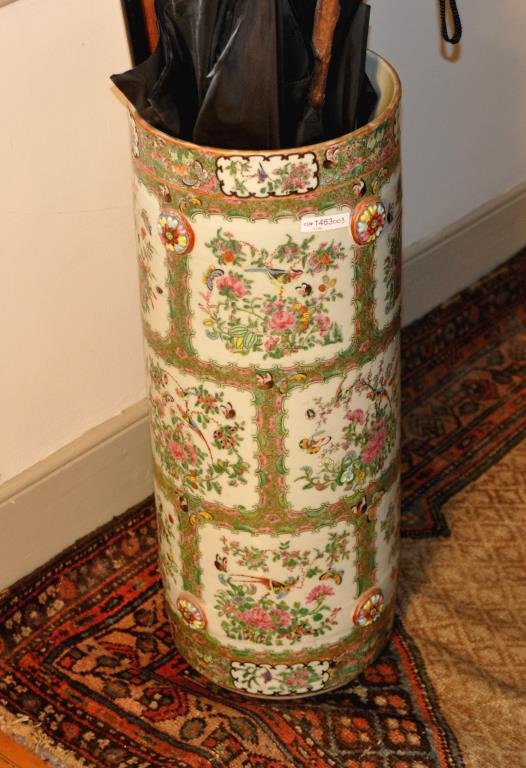 Rose Medallion Porcelain Umbrella Stand: Rose Medallion Porcelain Umbrella Stand In good condition, dating probably late 19th century; has eight raised floral bosses on exterior; fleabite on rim, age checks in bottom. 25" high, 9" diameter.