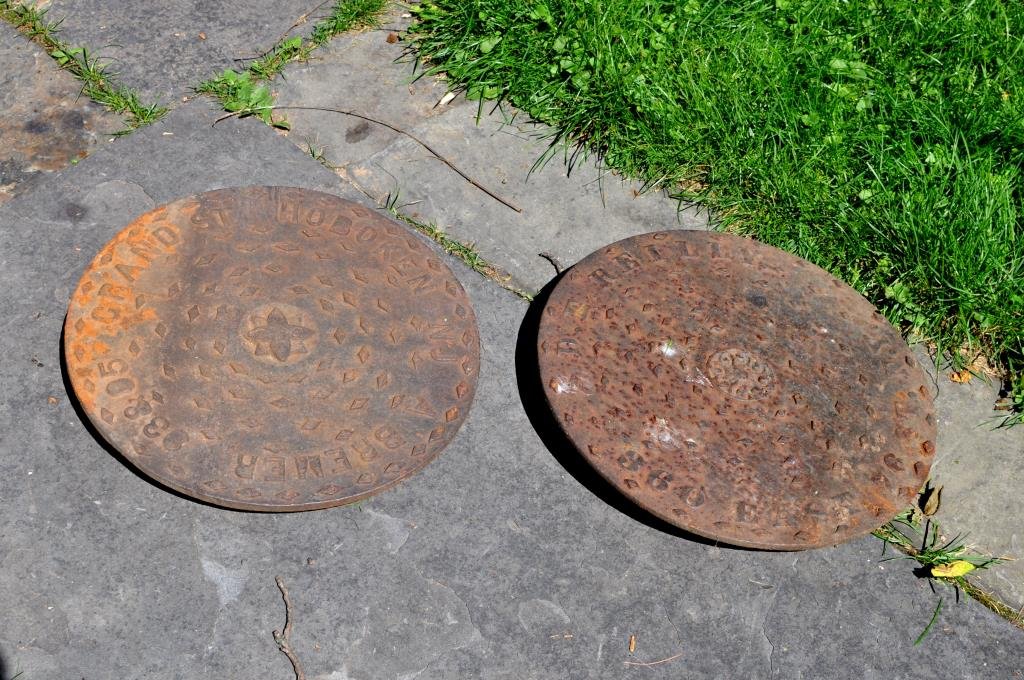 Two Cast Iron Folk Art Coal Chute Covers (1 of 3)