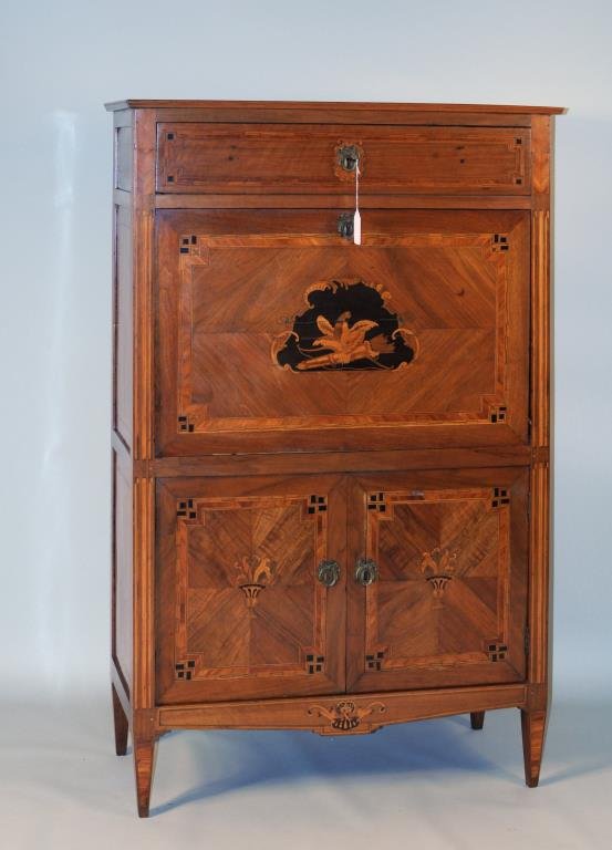 Continental Mixed Woods Inlaid Secretaire: Continental mixed woods inlaid secretaire a abattant, single drawer over drop front with bird and quiver inlay, two cupboard doors below on tapered legs. 57" high, 37 1/2" wide, 17" deep. Condition: a