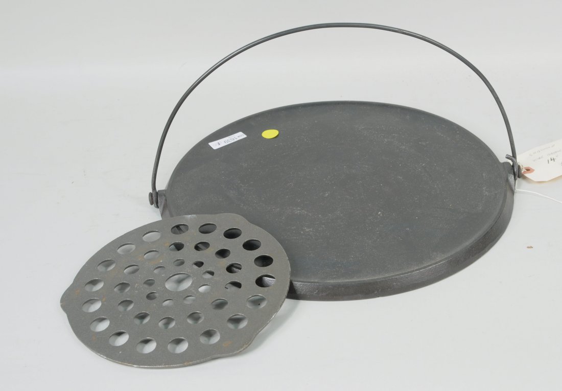 Vintage Griswold Griddle: Vintage Griswold griddle. 14 1/2" diameter. Condition: use wear, scratches, rust.