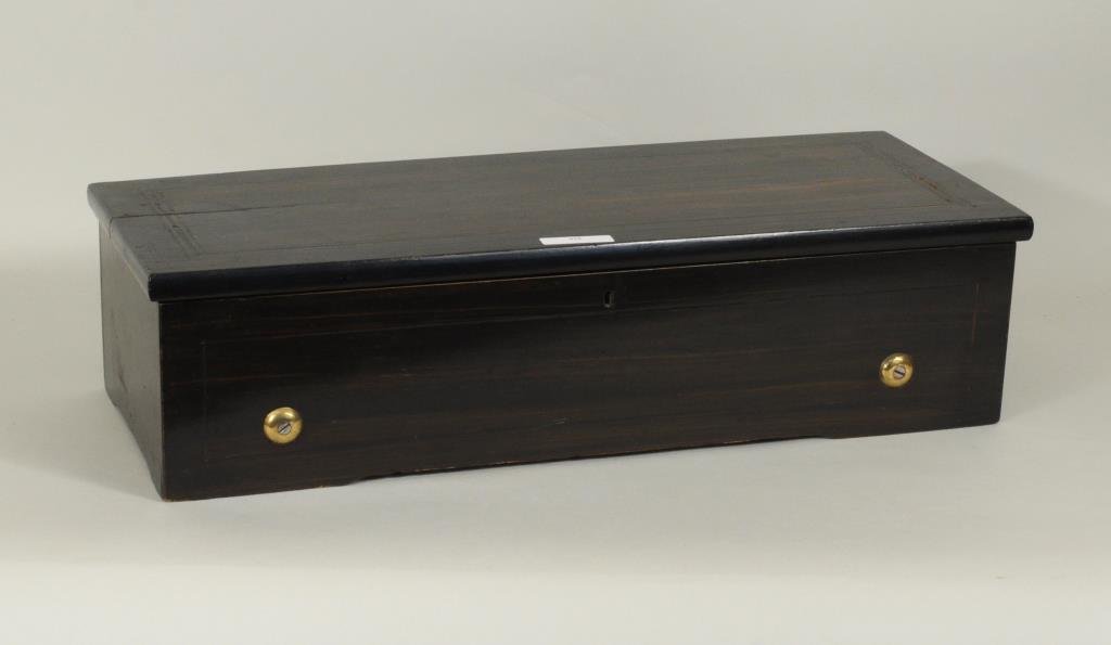Swiss Inlaid Rosewood Cylinder Music Box: Swiss inlaid rosewood cylinder music box. 12 1/2" cylinder, 5 1/2" high, 22 1/2" wide, 9" deep. Condition: small losses to string inlaid case, old split to top.