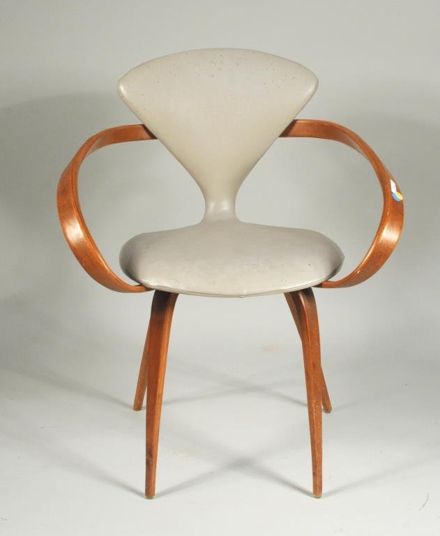 N. Cherner Molded Plywood Armchair For Plycraft: Norman Cherner molded plywood armchair for Plycraft with hourglass shaped seat and back. 31" high, 26 1/2" wide, 17 1/2" deep. Condition: use wear, finish wear, loss, soiling, tears to upholstery.