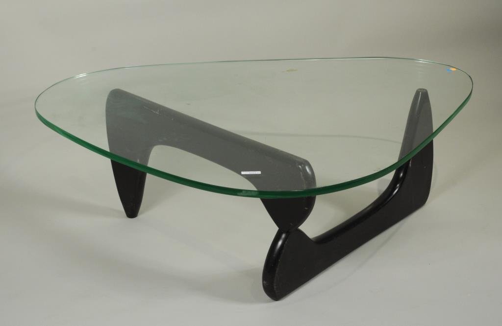 Isamu Noguchi/Herman Miller Style Coffee Table: Possibly Isamu Noguchi (Japanese, 1904-1988), coffee table for Herman Miller with with 3/4" thick glass top and aluminum pin holding two shaped base sections. 15 3/4" high, 43 1/2" wide, 40" deep. Con