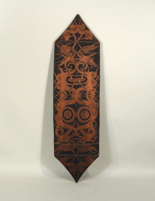 Tribal Carved & Painted Wood Shield: Tribal carved and painted wood shield. 53" long, 14 1/2" wide. Condition: paint wear, loss, mold on verso.