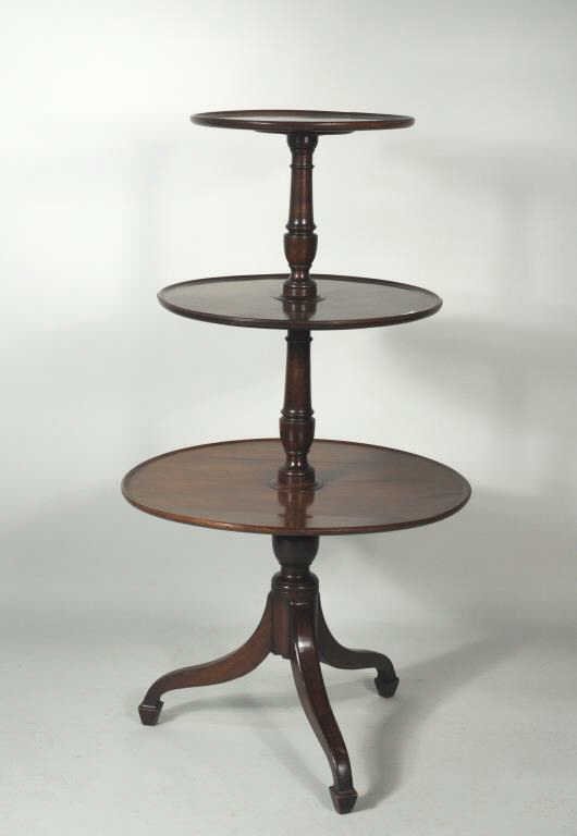 Hepplewhite Mahogany Three Tier Dumbwaiter: Hepplewhite mahogany three tier dumbwaiter, the tops with molded edge and supported by vase and column standards, raised on a spade foot tripod base. England, circa 1780. 51" high, 27" wide, 27" deep 