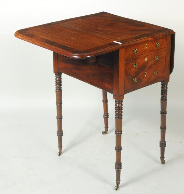 Regency Inlaid Mahogany Drop Leaf Work Table: Regency inlaid mahogany drop leaf work table with rosewood and string inlaid crossbanding. 28 1/4" high, 15 1/4" wide, 21" deep. Open: 28 1/4" high, 32 1/2" wide, 21" deep. Condition: age and use wear