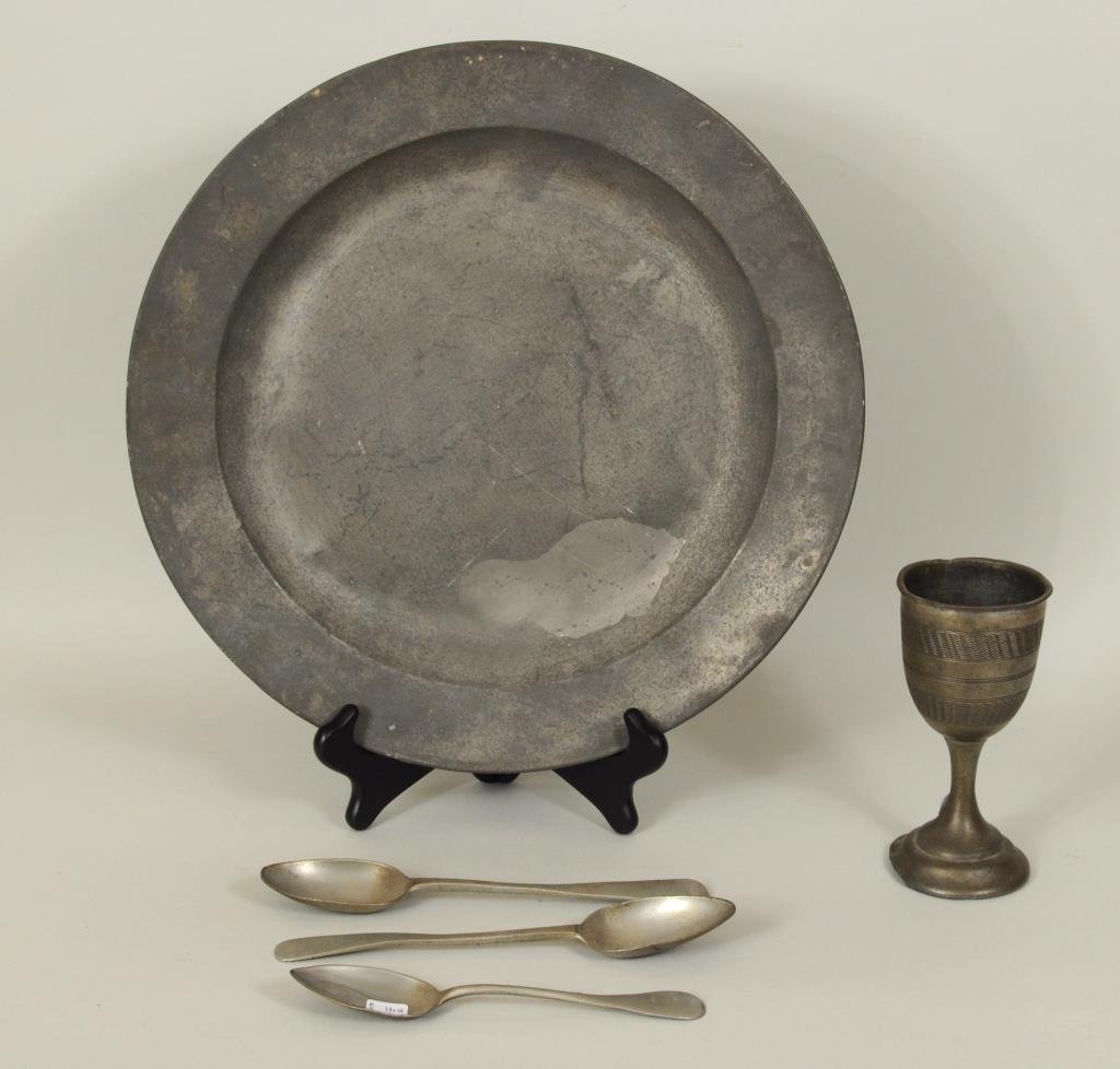 Five Pewter Items: Five pewter items comprising a charger by Samuel Ellis, London circa 1640, together with a chalice and three spoons. 7 1/2" high, 1 5/8" wide to 15" diameter. Condition: repairs, scratches, dings, cra