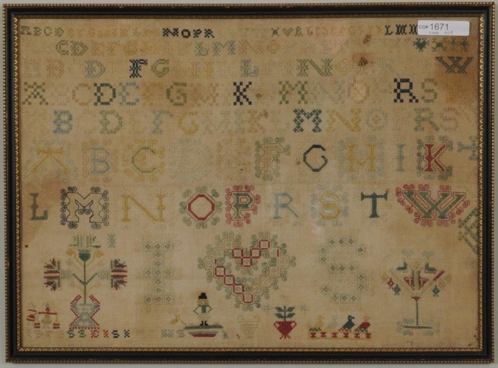 Needlework Alphabet Sampler: Needlework alphabet sampler depicting a heart, floral urns and other subjects. Framed, not examined out of frame. Sight size: 11 1/4" high, 15 1/4" wide. Frame size: 12 1/4" high, 16 3/4" wide. Condit