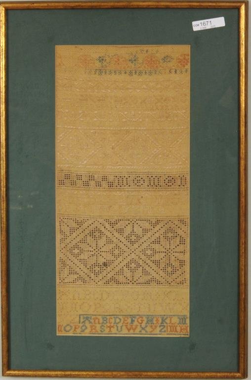 Needlework Alphabet Sampler: Needlework alphabet sampler. Framed, not examined out of frame. Sight size: 15 1/2" high, 7 1/4" wide. Frame size: 20 1/2" high, 13 1/4" wide. Condition: toning, stains, losses.