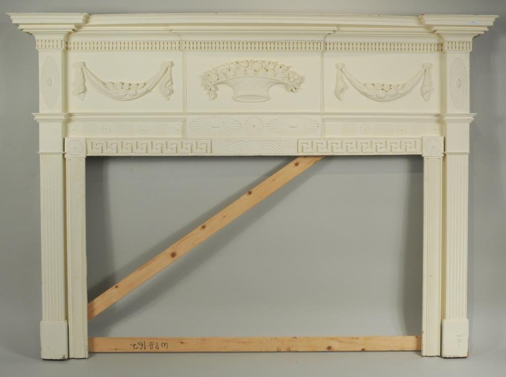 Federal Style Carved Fireplace Mantle: Federal style carved pine fireplace mantle, with carved basket of fruit, manner of Samuel McIntyre. 58" high, 79.5" wide, 8" deep. Opening 34" high, 56.5" wide. Provenance: Connecticut collection.